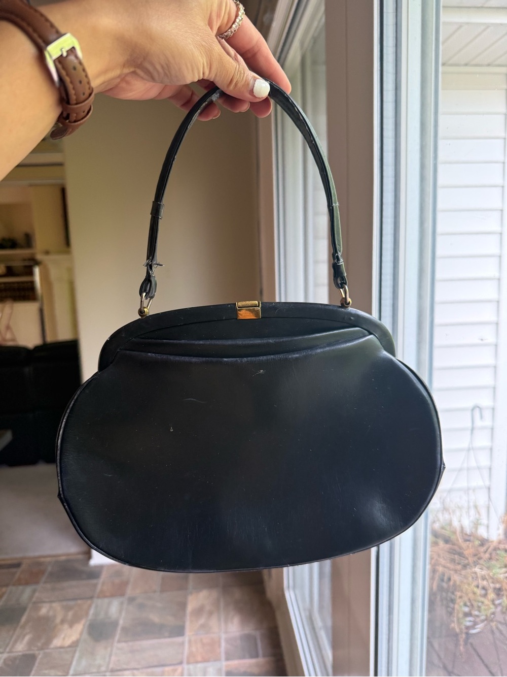 Vintage black leather mid-century handbag
